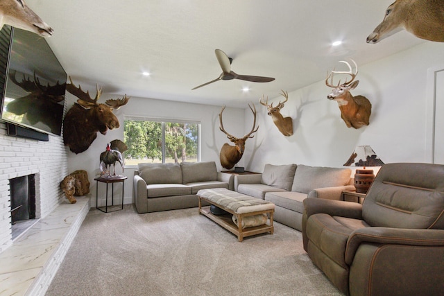 living area with recessed lighting, a brick fireplace, carpet flooring, and ceiling fan