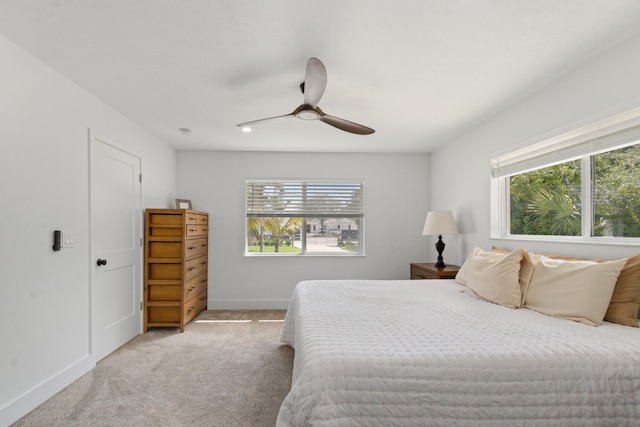 bedroom with carpet, ceiling fan, and baseboards