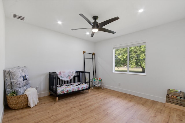 bedroom featuring baseboards, visible vents, a ceiling fan, wood finished floors, and recessed lighting