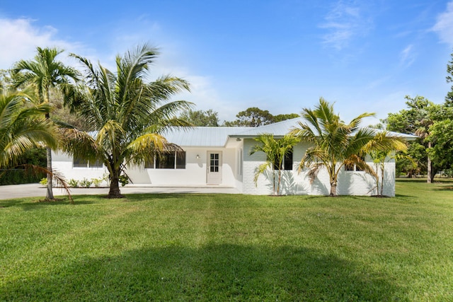 single story home with a front lawn and stucco siding