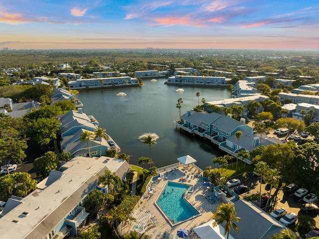 aerial view at dusk with a water view