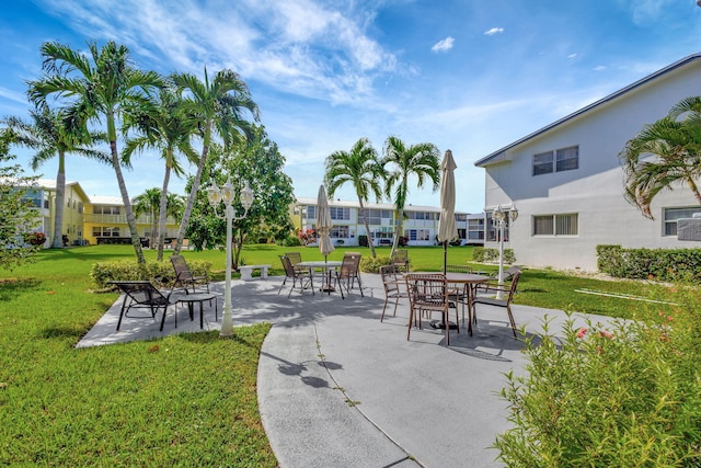 view of property's community with a lawn