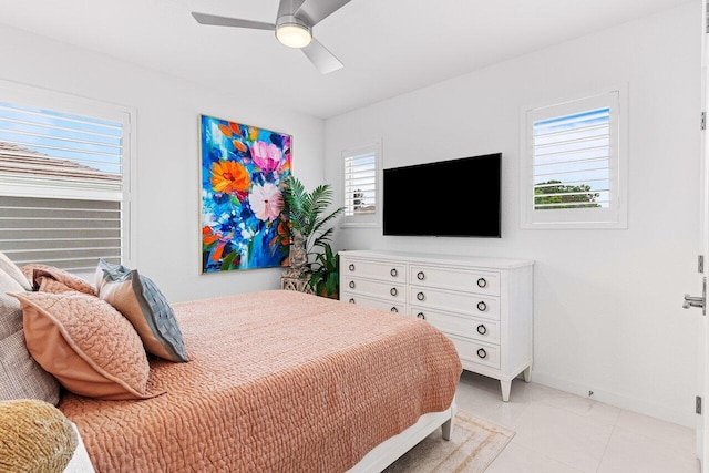 bedroom featuring ceiling fan and baseboards