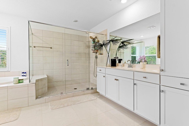 full bathroom featuring a stall shower, visible vents, tile patterned flooring, vanity, and a bath