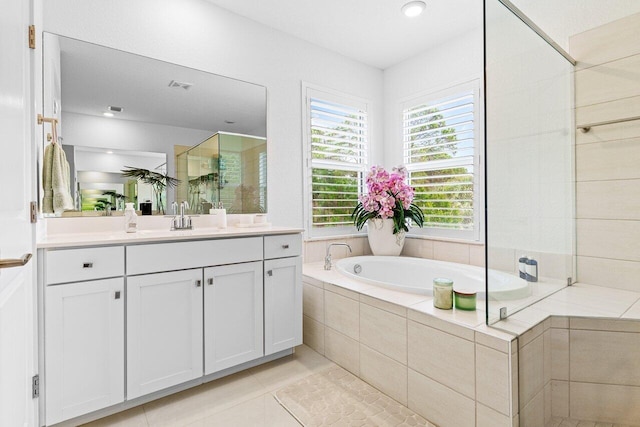 full bath with visible vents, vanity, a bath, tile patterned floors, and a stall shower