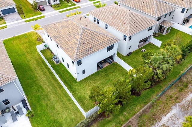 birds eye view of property with a residential view