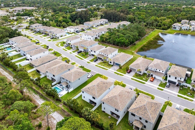 bird's eye view with a water view and a residential view