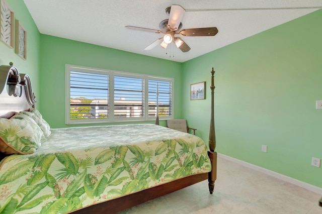 bedroom with baseboards and ceiling fan