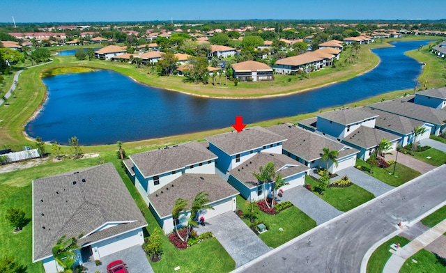 bird's eye view featuring a residential view and a water view