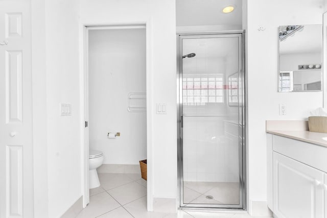 full bathroom featuring vanity, a shower stall, toilet, and tile patterned floors