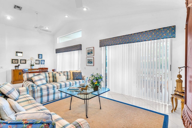 tiled living room with high vaulted ceiling, recessed lighting, visible vents, and a ceiling fan