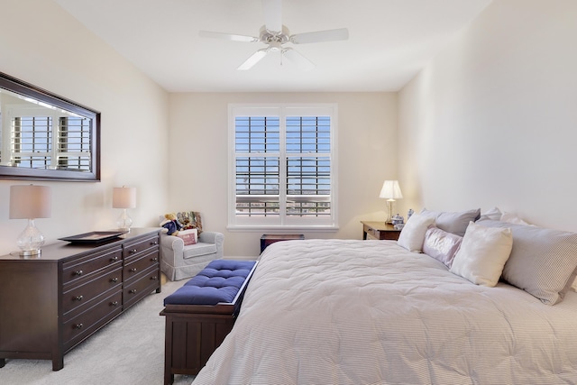 bedroom featuring a ceiling fan and light carpet