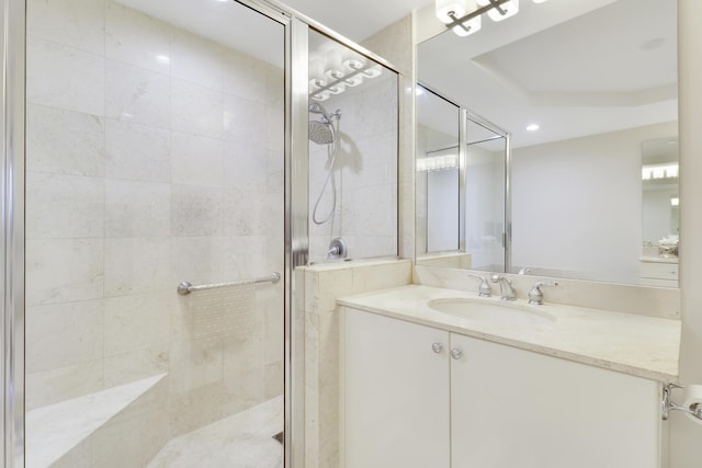 bathroom featuring a stall shower and vanity