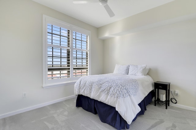 carpeted bedroom with baseboards and ceiling fan