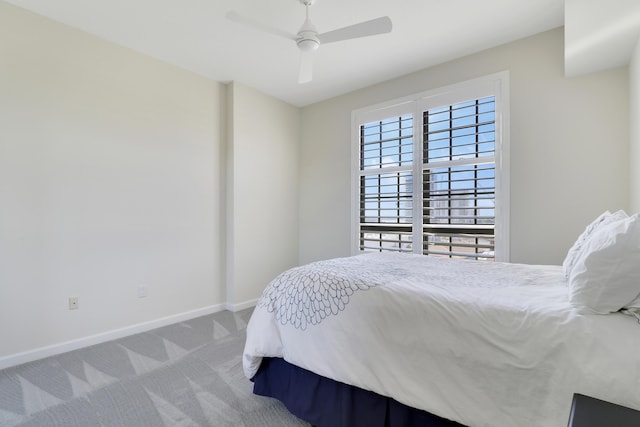 bedroom with carpet, baseboards, and ceiling fan