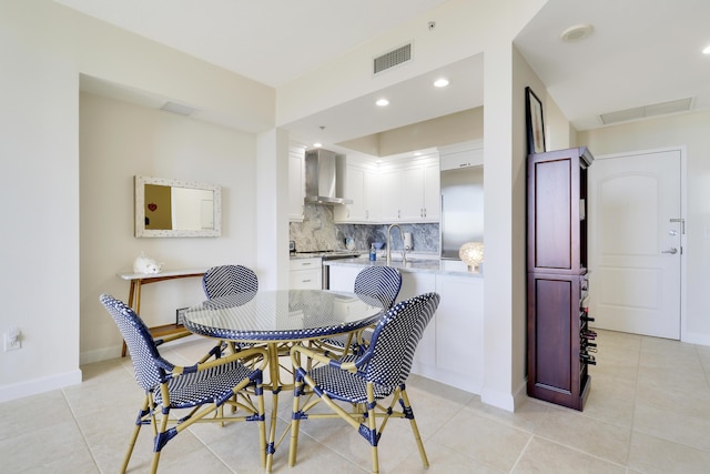 dining space featuring light tile patterned flooring, visible vents, recessed lighting, and baseboards