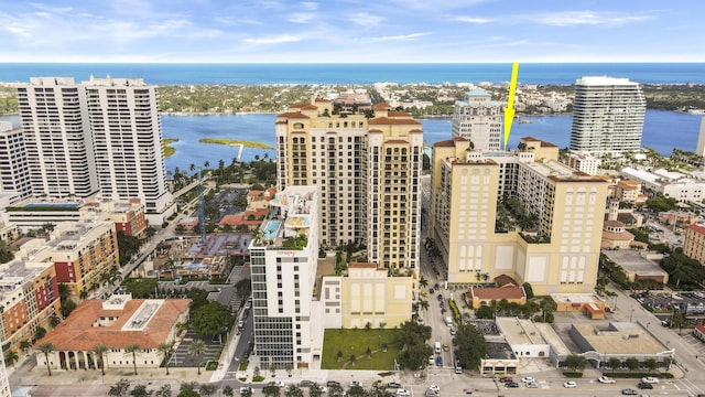 drone / aerial view with a city view and a water view