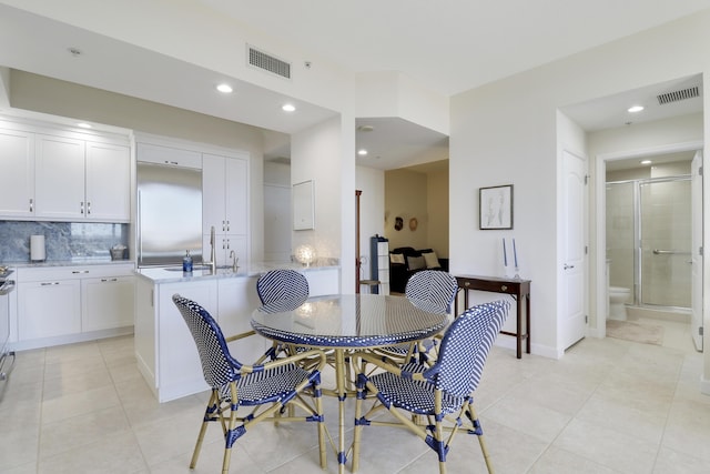 dining space featuring light tile patterned floors, visible vents, and recessed lighting