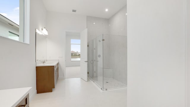 full bath featuring a stall shower and vanity