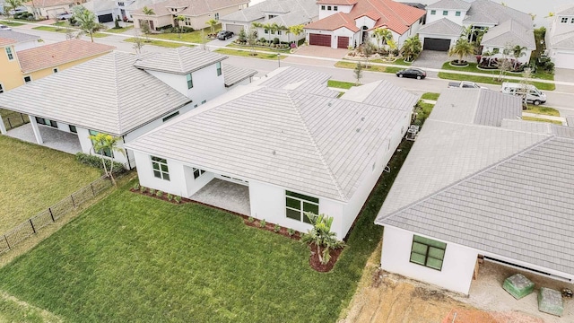 birds eye view of property with a residential view