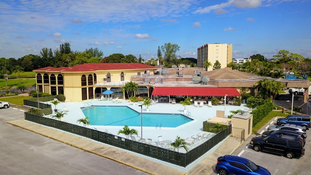 community pool featuring a patio area