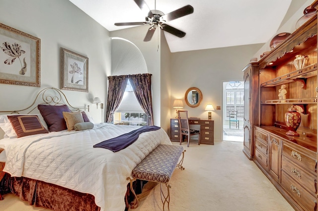 bedroom with light carpet, vaulted ceiling, and ceiling fan