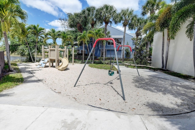 community jungle gym featuring fence