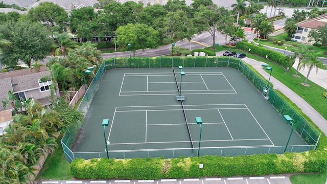 view of tennis court featuring fence