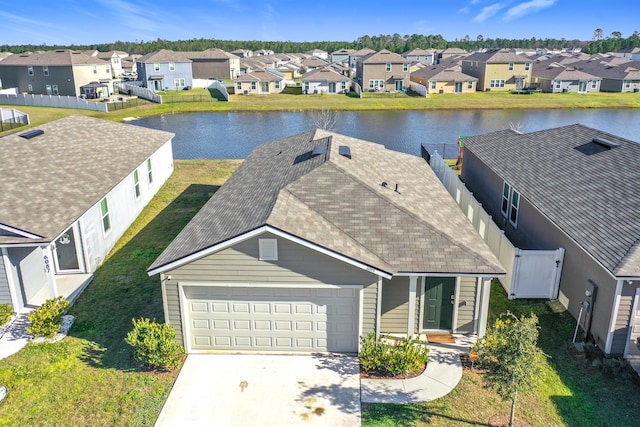 bird's eye view with a residential view and a water view