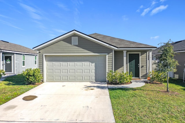 single story home with a garage, driveway, and a front yard