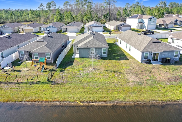 bird's eye view with a residential view and a water view