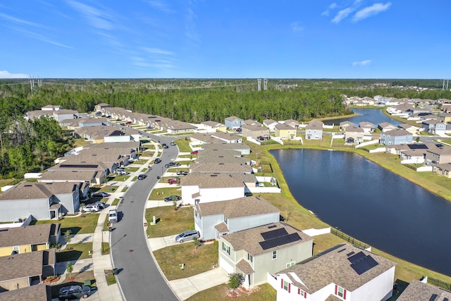 birds eye view of property with a residential view and a water view