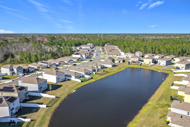 birds eye view of property with a residential view and a water view