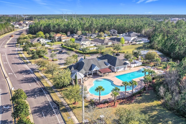 birds eye view of property with a residential view and a forest view