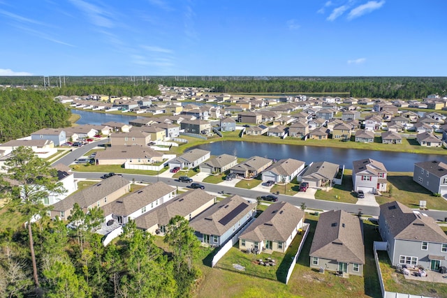 bird's eye view featuring a residential view and a water view