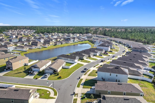 bird's eye view featuring a residential view and a water view