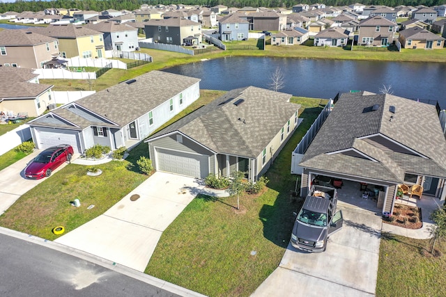 bird's eye view featuring a residential view and a water view