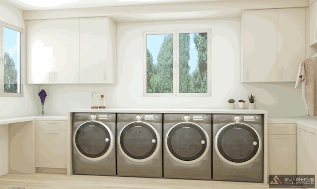 laundry area featuring cabinet space and independent washer and dryer