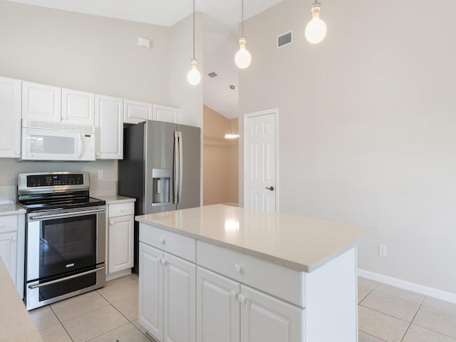 kitchen featuring stainless steel appliances, light countertops, visible vents, and light tile patterned floors