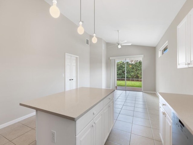 kitchen with light tile patterned floors, white cabinetry, light countertops, and dishwasher