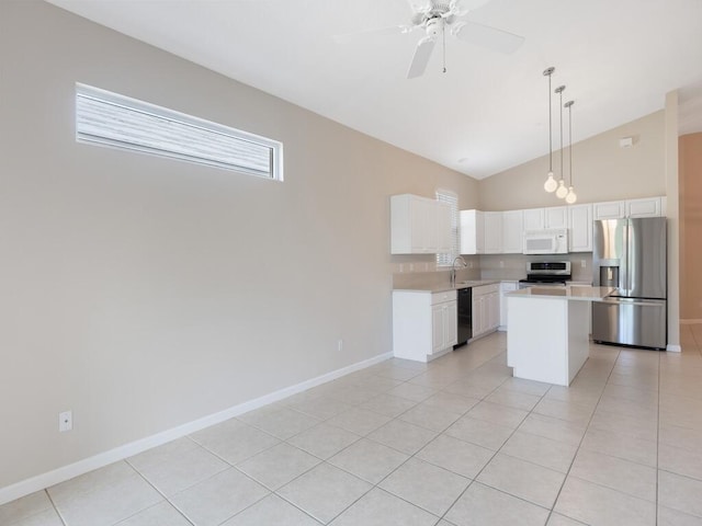 kitchen with white cabinets, ceiling fan, stainless steel appliances, light countertops, and a sink