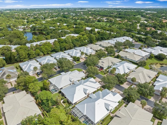 bird's eye view with a residential view and a water view