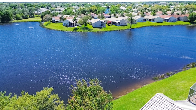 birds eye view of property with a residential view and a water view