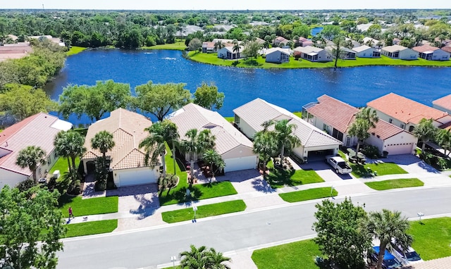 aerial view with a residential view and a water view