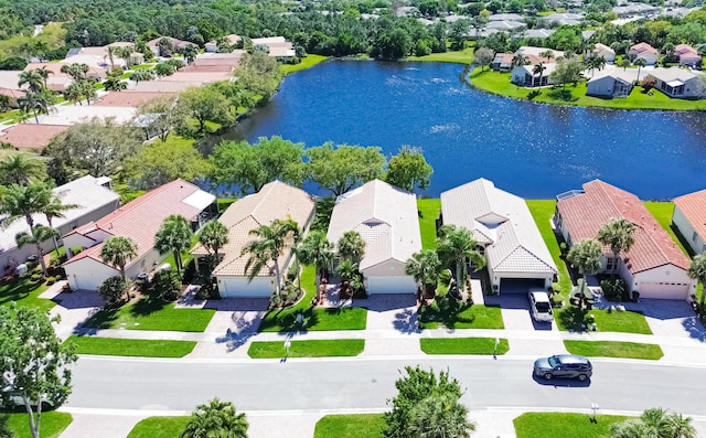 aerial view with a residential view and a water view