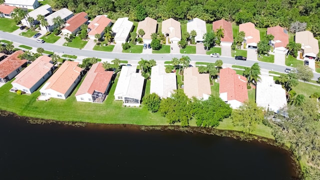 bird's eye view featuring a water view and a residential view