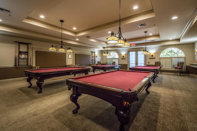 rec room with carpet, a raised ceiling, visible vents, and french doors