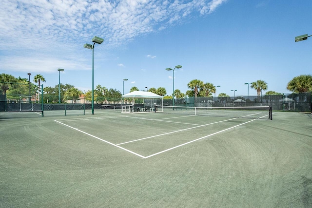 view of sport court with fence