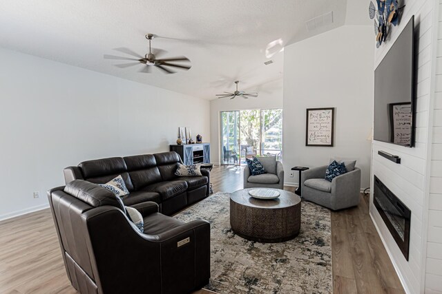 dining room featuring ceiling fan, light wood-type flooring, and baseboards