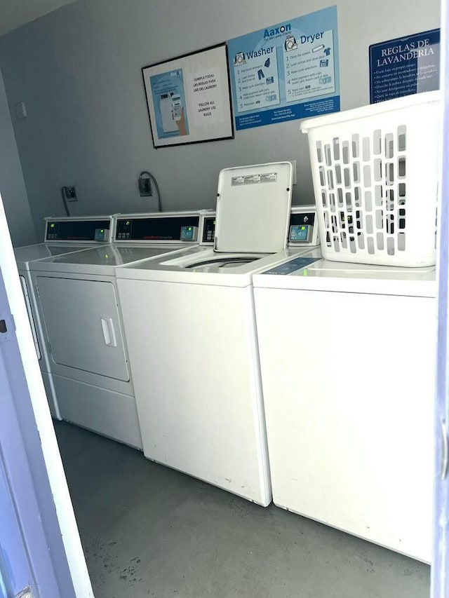 shared laundry area with separate washer and dryer